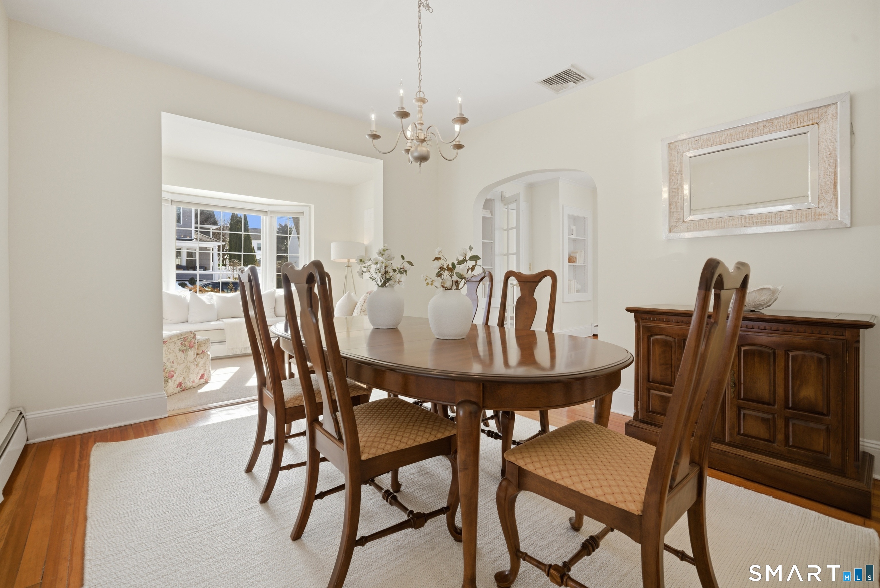 224 Homeland Street Fairfield, CT 06825 - Photo 8 of 37 a view of a dining room with furniture and chandelier