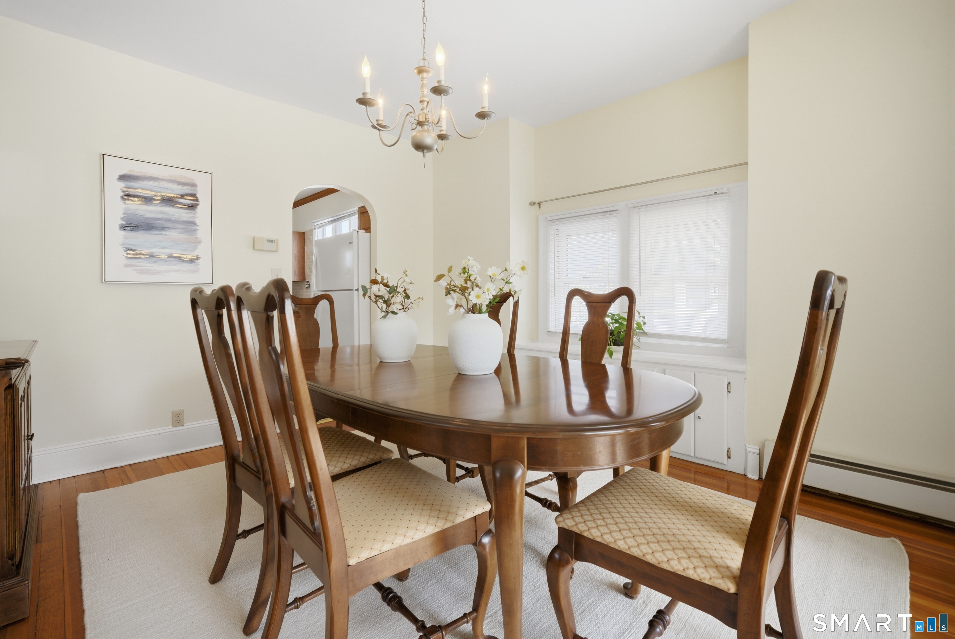 224 Homeland Street Fairfield, CT 06825 - Photo 9 of 37 a view of a dining room with furniture and wooden floor