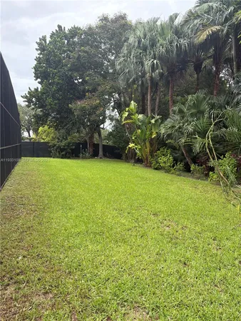 a view of street next to a yard