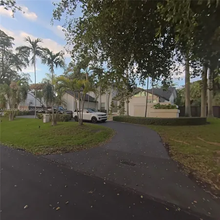 a view of street with parked cars