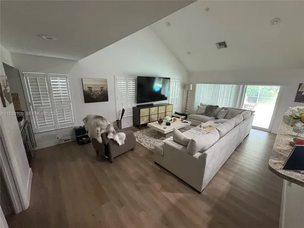 a living room with furniture fireplace and a flat screen tv