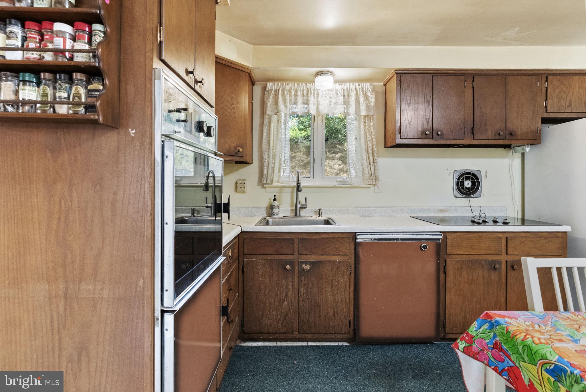 25 Hillendale Road Chadds Ford, PA 19317 - Photo 15 of 40 a kitchen with stainless steel appliances granite countertop a sink stove and cabinets