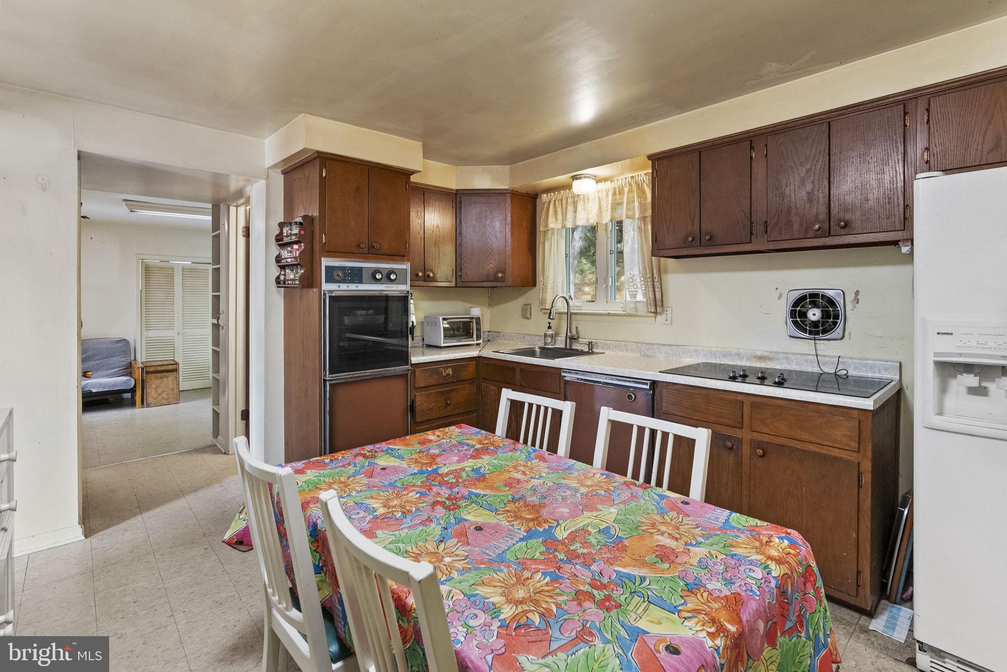 25 Hillendale Road Chadds Ford, PA 19317 - Photo 16 of 40 a kitchen that has a lot of cabinets in it and appliances