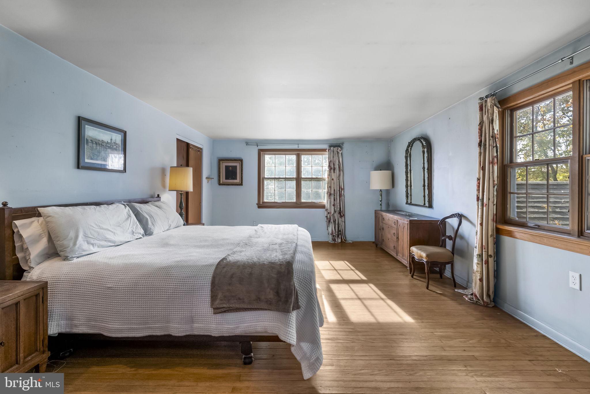25 Hillendale Road Chadds Ford, PA 19317 - Photo 23 of 40 a bedroom with a bed and a large window