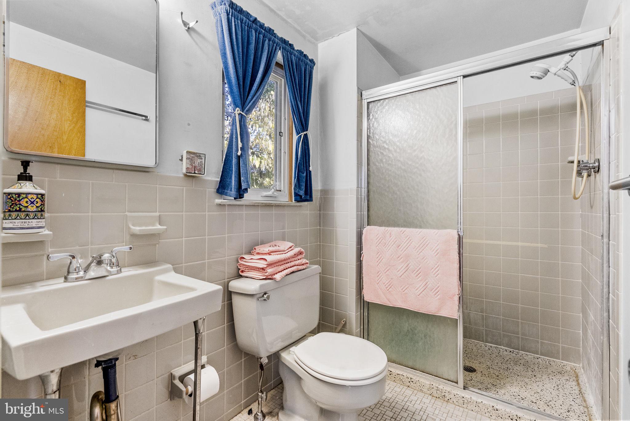 25 Hillendale Road Chadds Ford, PA 19317 - Photo 25 of 40 a bathroom with a sink toilet and shower