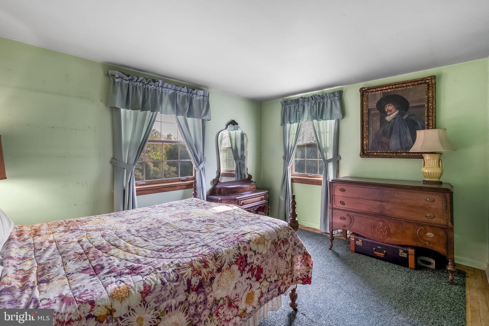 25 Hillendale Road Chadds Ford, PA 19317 - Photo 27 of 40 a bedroom with a bed and a window