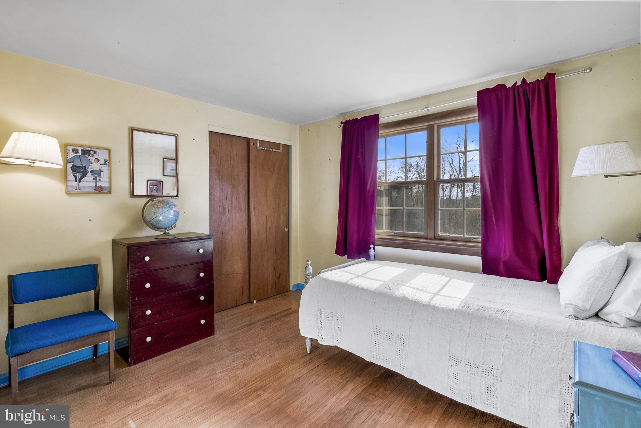25 Hillendale Road Chadds Ford, PA 19317 - Photo 28 of 40 a bedroom with a bed and a dresser