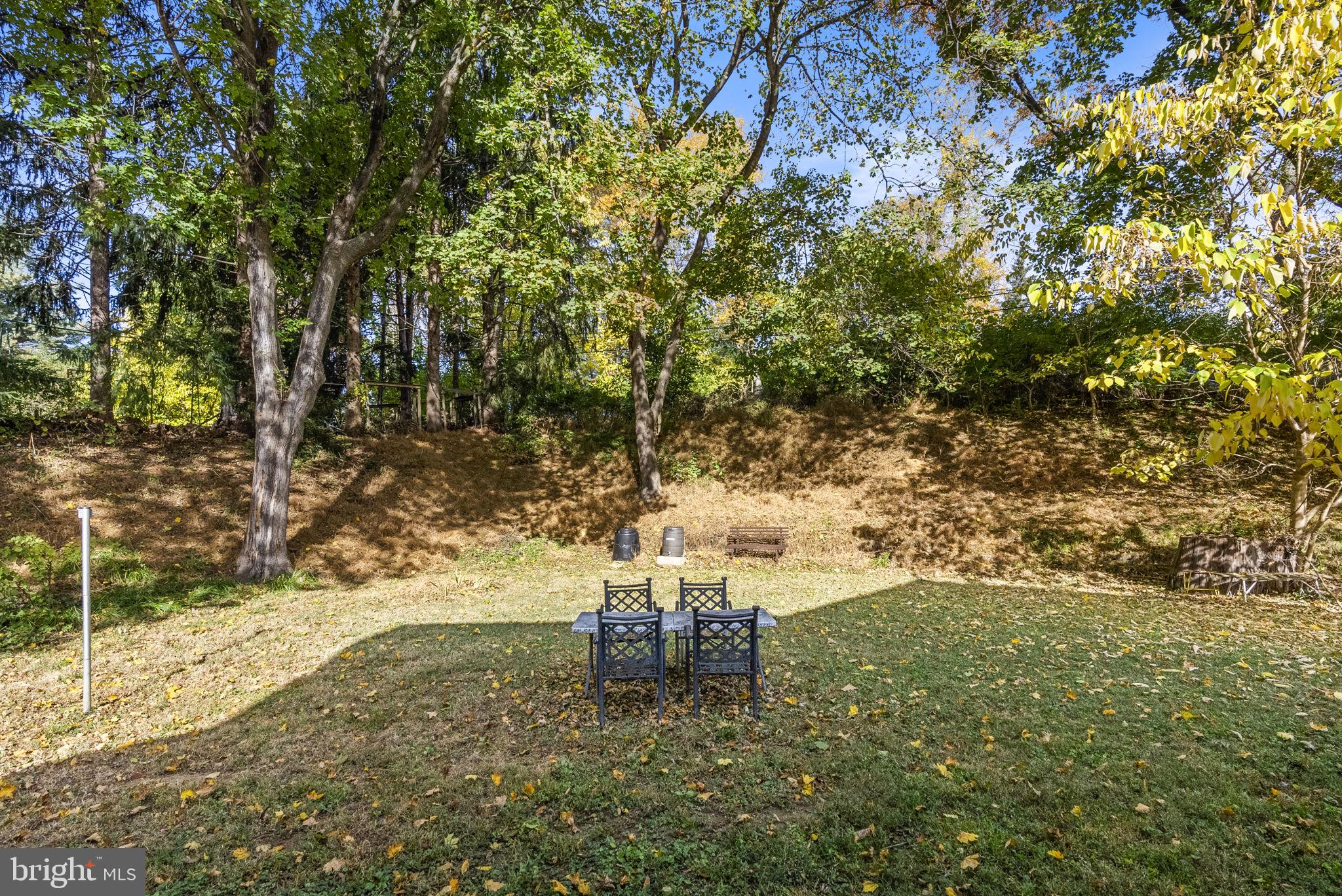 25 Hillendale Road Chadds Ford, PA 19317 - Photo 34 of 40 a backyard of a house with yard and outdoor seating