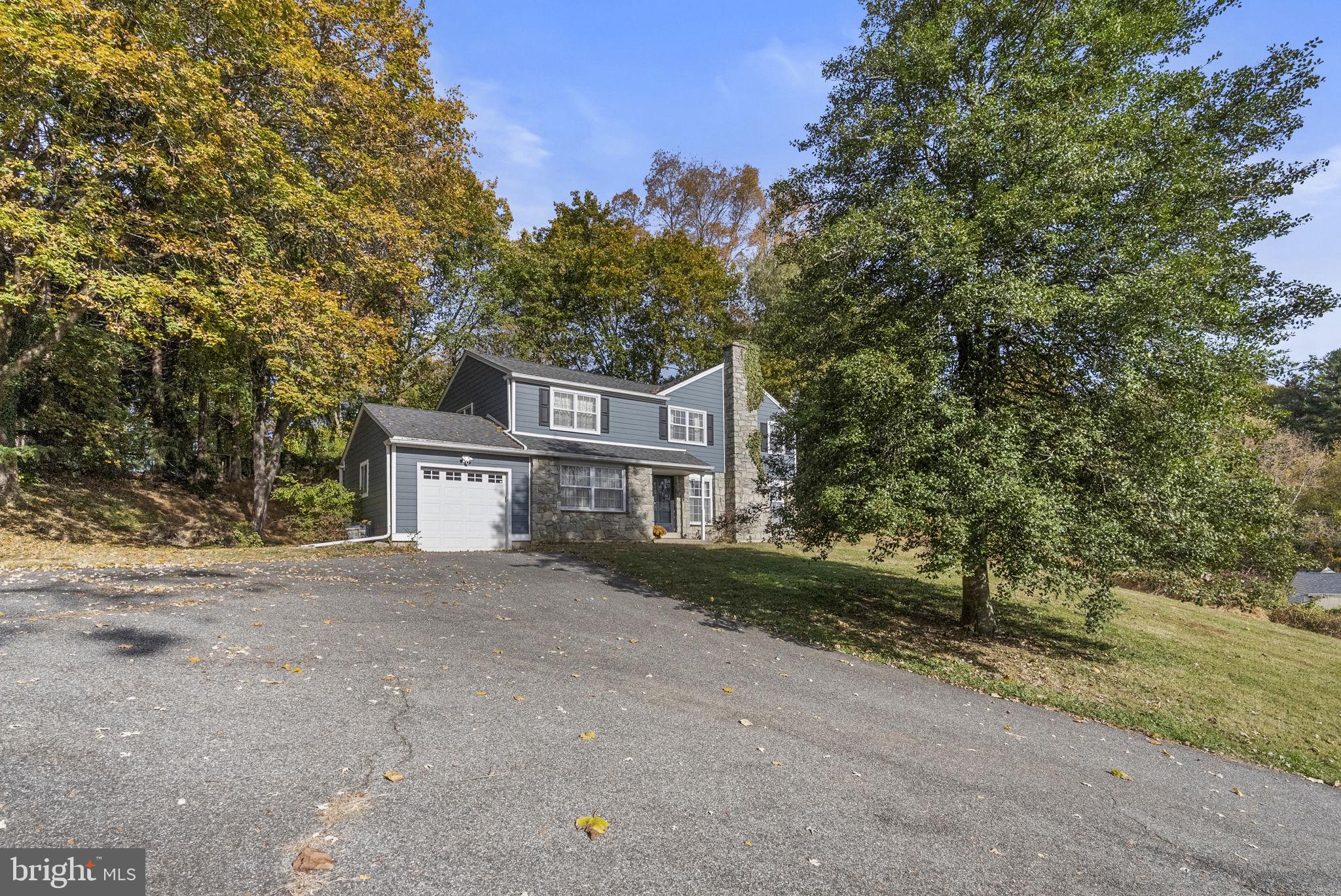 25 Hillendale Road Chadds Ford, PA 19317 - Photo 36 of 40 front view of a house with a street
