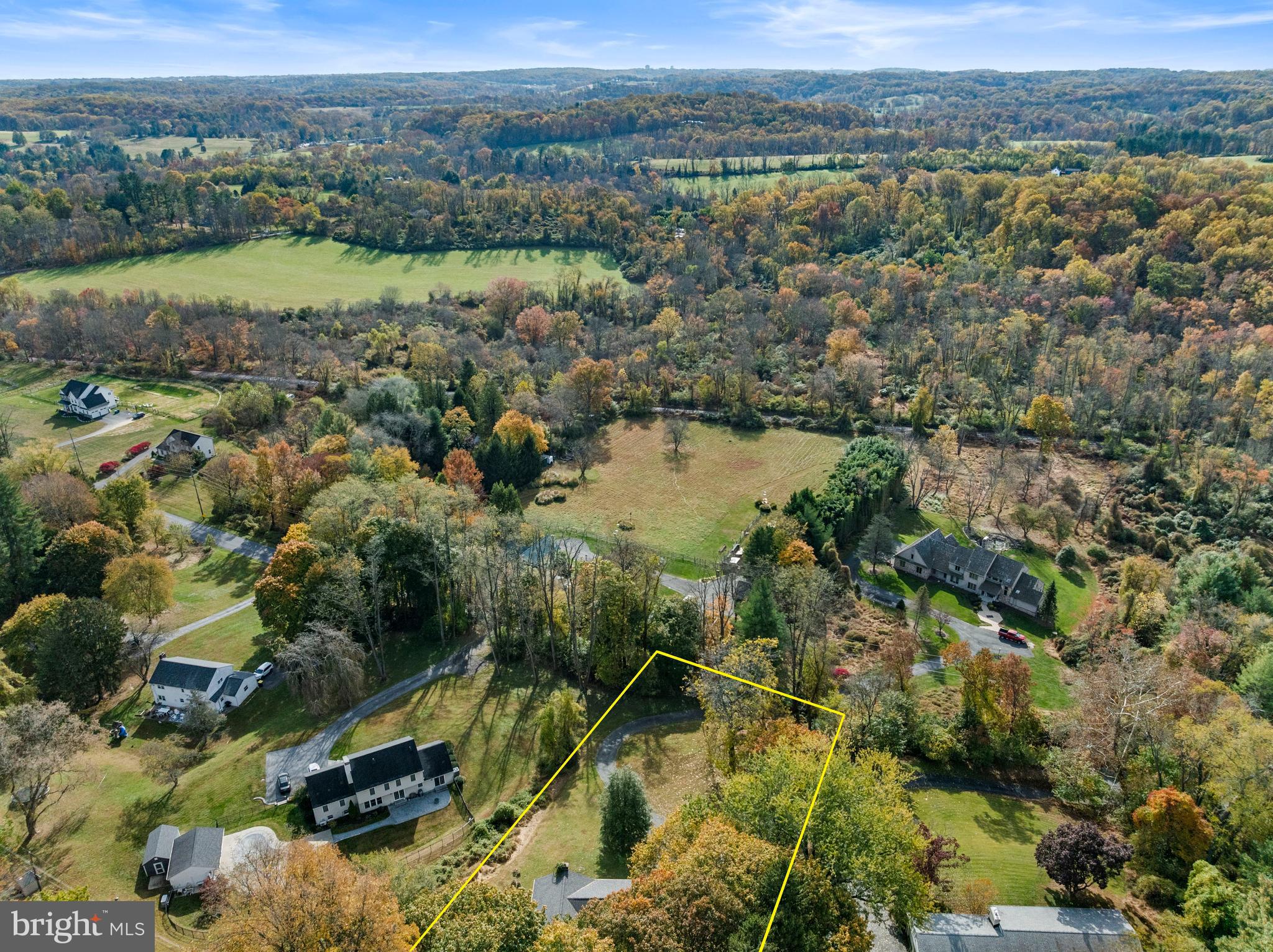 25 Hillendale Road Chadds Ford, PA 19317 - Photo 38 of 40 an aerial view of green landscape with trees houses and lake view