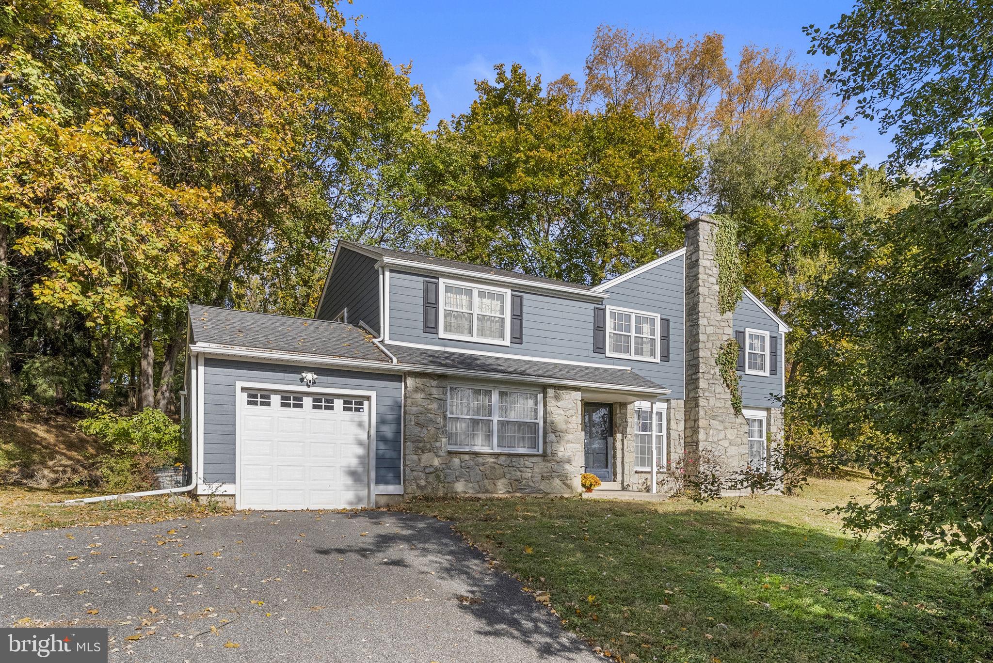 25 Hillendale Road Chadds Ford, PA 19317 - Photo 5 of 40 a front view of a house with a garden