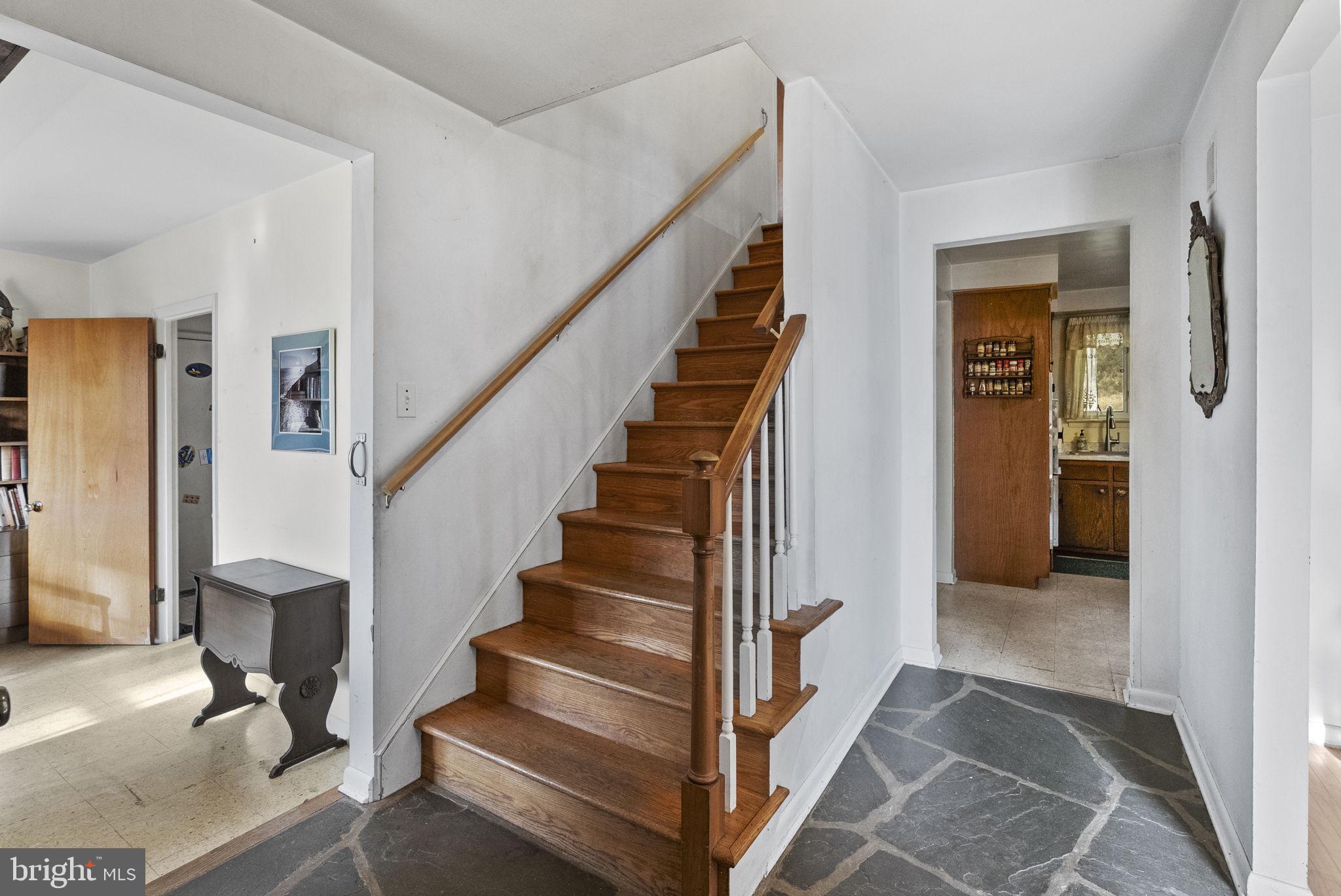 25 Hillendale Road Chadds Ford, PA 19317 - Photo 8 of 40 a view of staircase with white walls and a rug