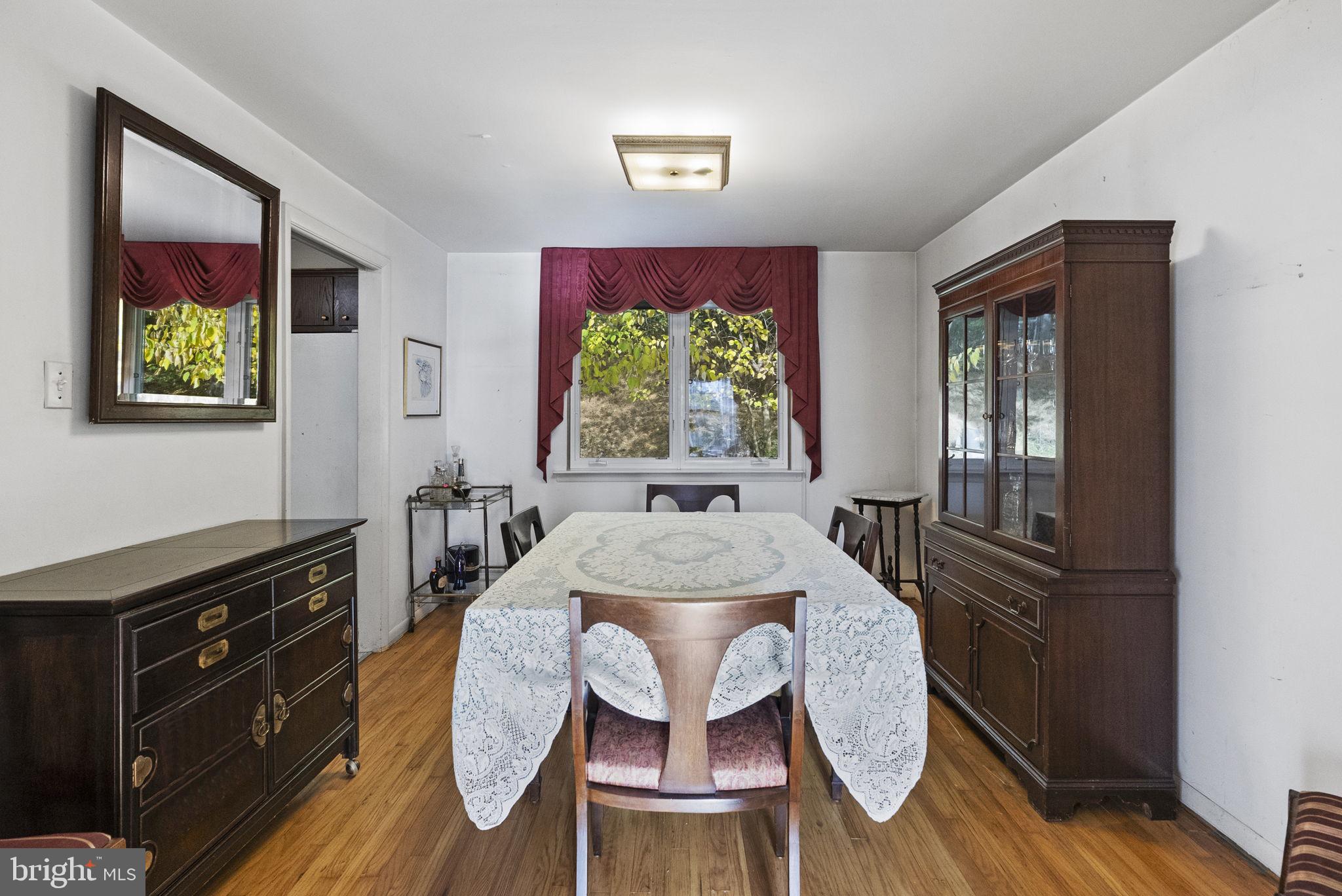 25 Hillendale Road Chadds Ford, PA 19317 - Photo 9 of 40 a view of a dining room with furniture a chandelier and wooden floor