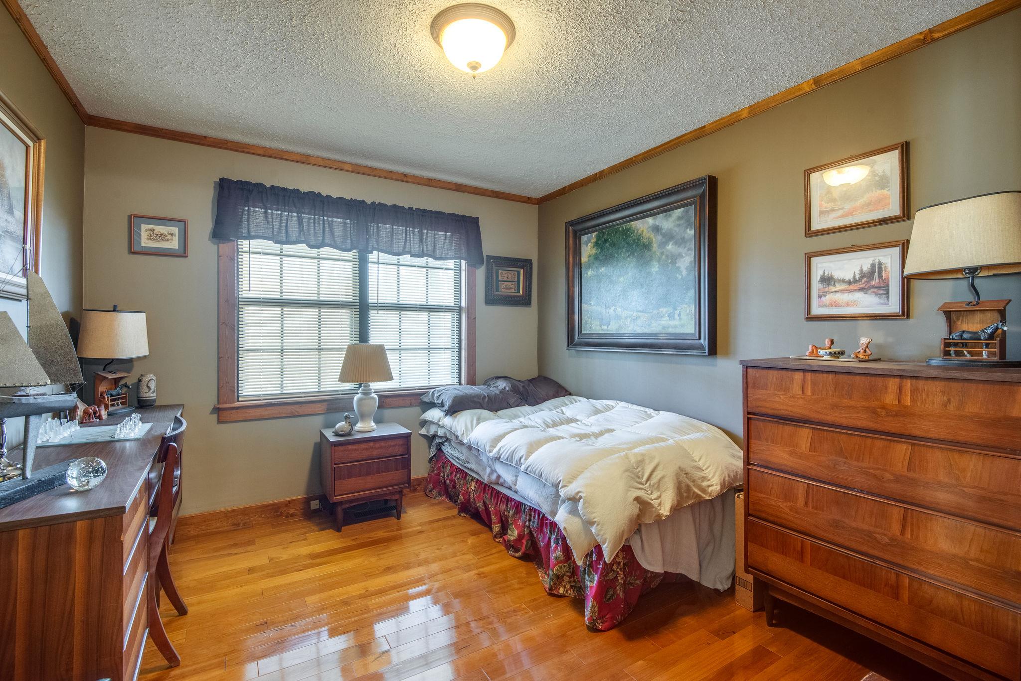 702 Mathis Road Charlotte, TN 37036 - Photo 11 of 22 Main Floor Bedroom has hardwood Floors