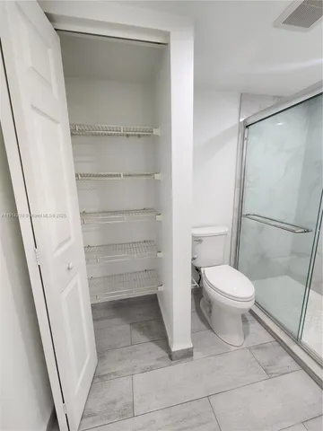 a view of a room with racks on the wall