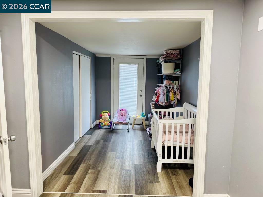 4400 Gateway Road, Unit 62 Bethel Island, CA 94511 - Photo 2 of 6 a bedroom with furniture and wooden floor