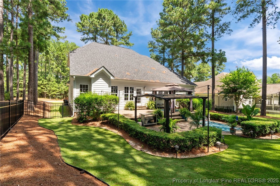256 Barons Run West Spring Lake, NC 28390 - Photo 11 of 44 a aerial view of a house with a yard table and chairs
