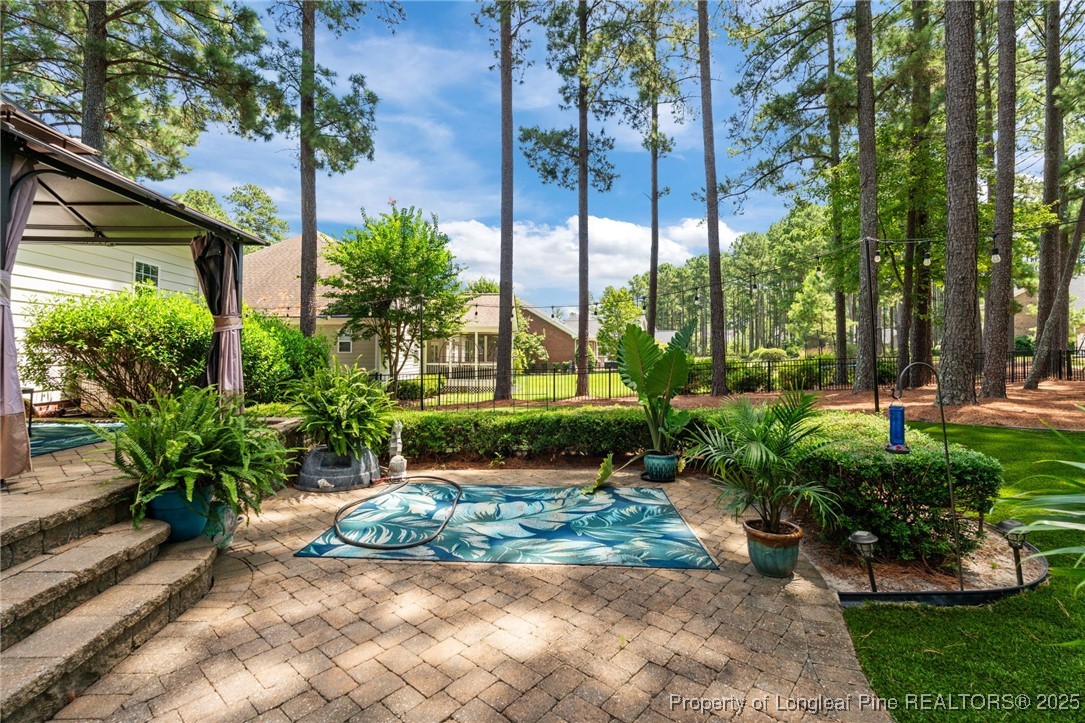 256 Barons Run West Spring Lake, NC 28390 - Photo 13 of 44 a view of a garden with a patio