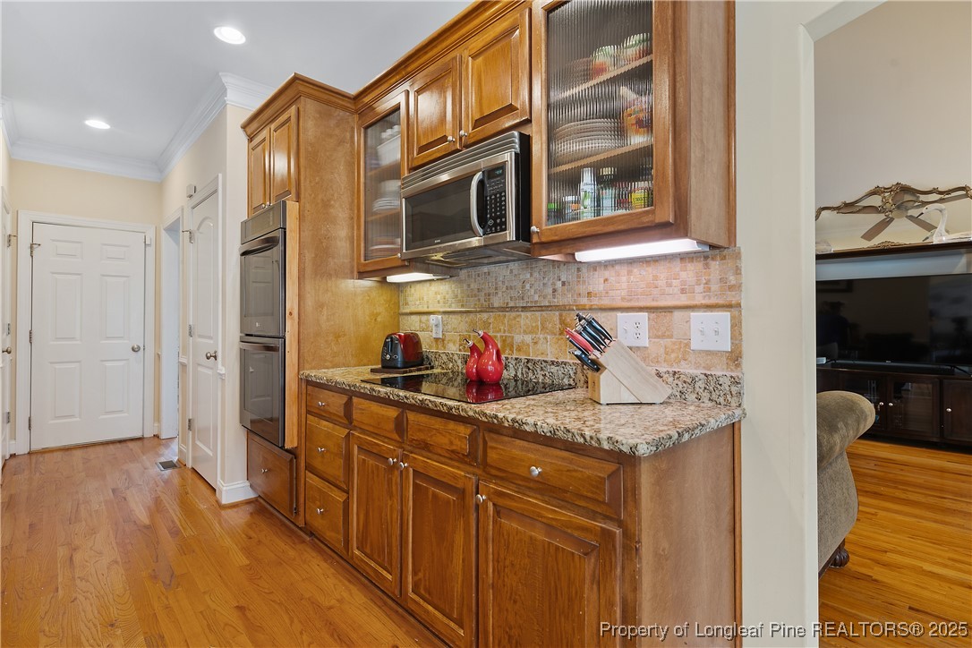 256 Barons Run West Spring Lake, NC 28390 - Photo 19 of 44 a kitchen with stainless steel appliances granite countertop a sink and cabinets