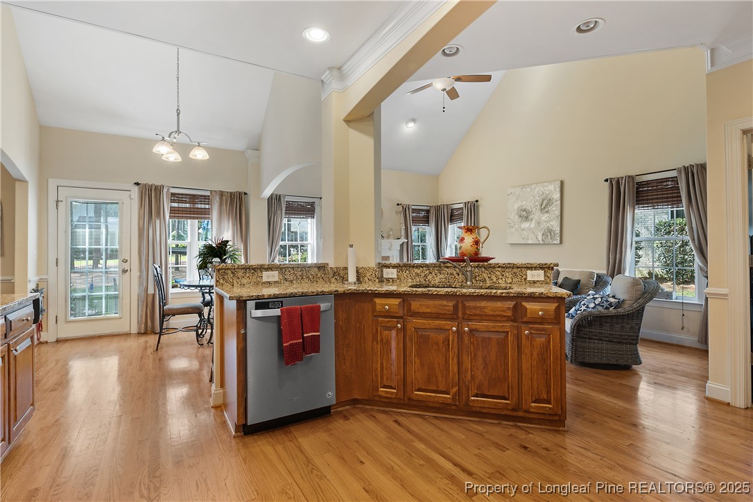 256 Barons Run West Spring Lake, NC 28390 - Photo 21 of 44 a view of living room with kitchen island granite countertop furniture and a fireplace