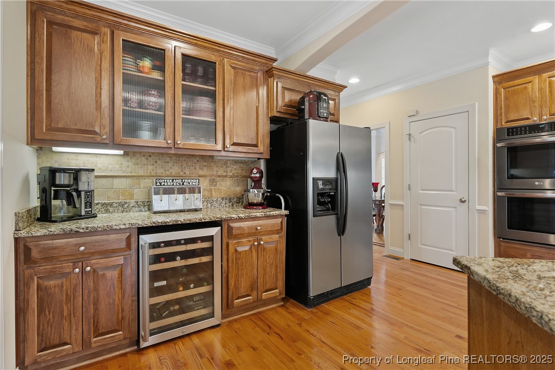 256 Barons Run West Spring Lake, NC 28390 - Photo 22 of 44 a kitchen with stainless steel appliances granite countertop a refrigerator and a stove top oven