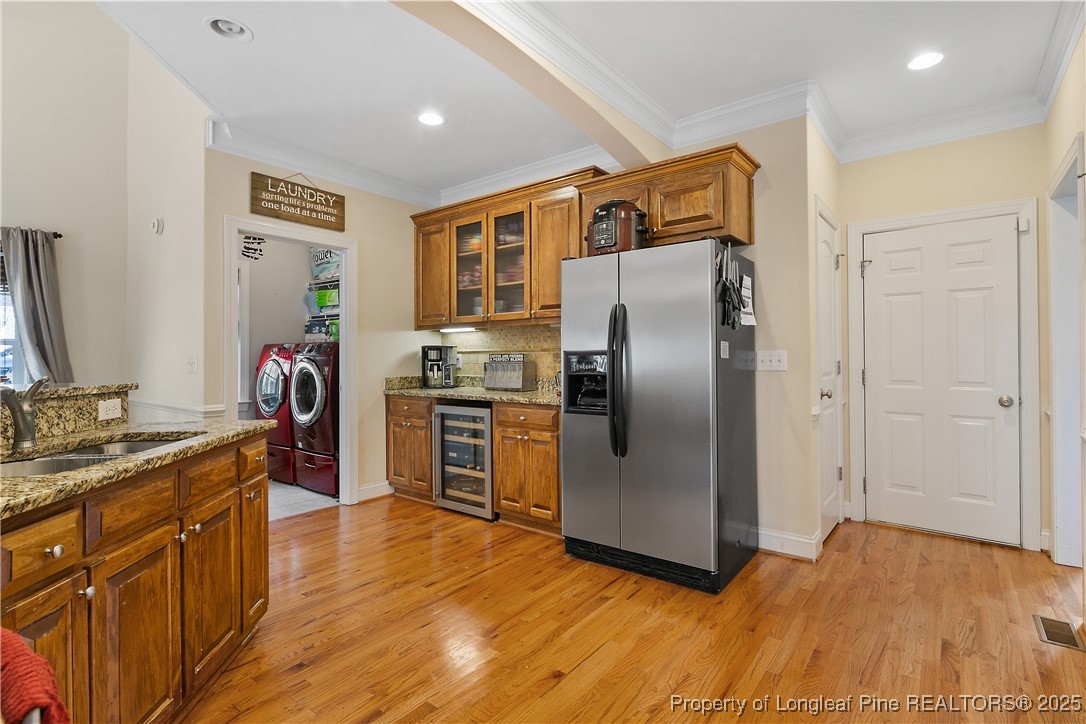 256 Barons Run West Spring Lake, NC 28390 - Photo 23 of 44 a kitchen with stainless steel appliances granite countertop a refrigerator and a sink