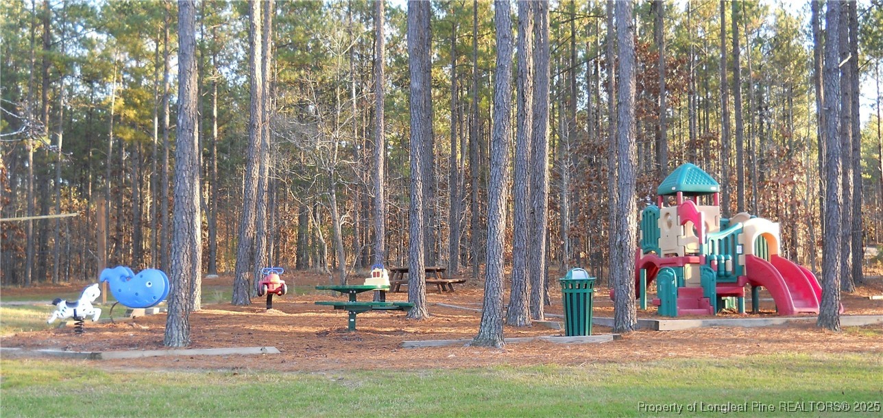 256 Barons Run West Spring Lake, NC 28390 - Photo 42 of 44 a building with trees in front of it