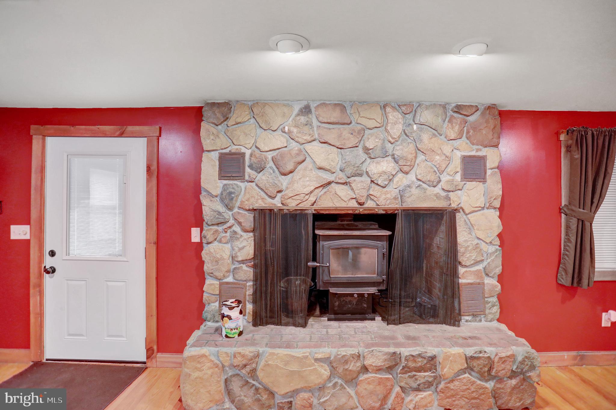 2407 Laurel Run Road Landisburg, PA 17040 - Photo 7 of 36 stone fireplace with wood stove insert