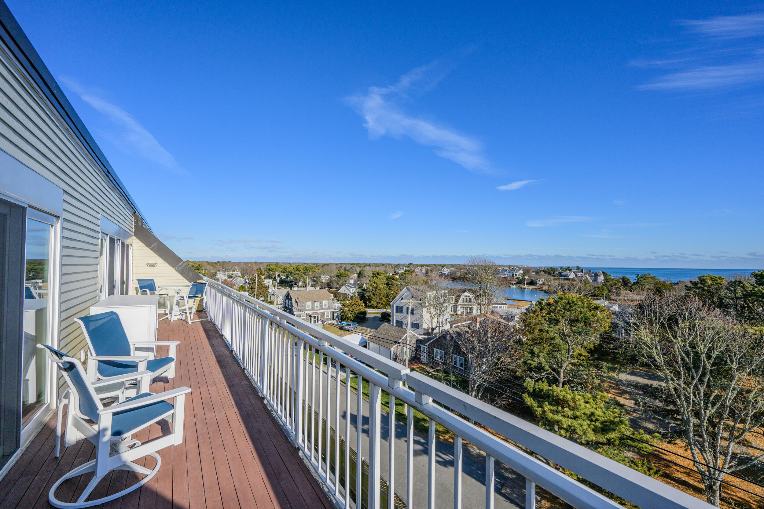 1 Belmont Road, Unit 541 West Harwich, MA 02671 - Photo 2 of 31 a view of a balcony with wooden floor and fence