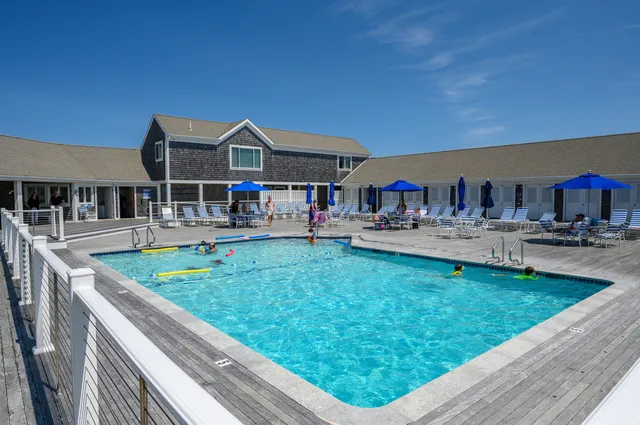 a view of a swimming pool with a yard