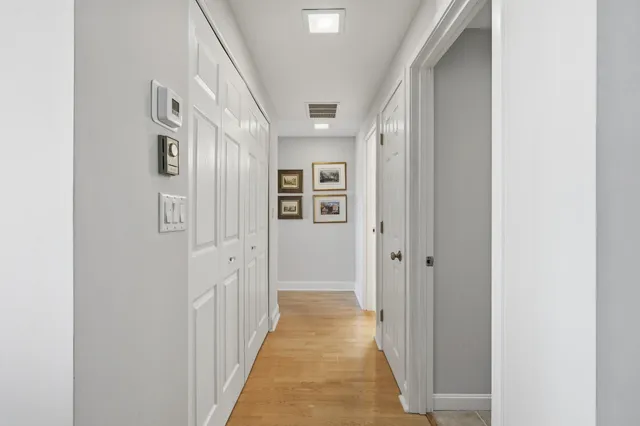 a view of a hallway with windows