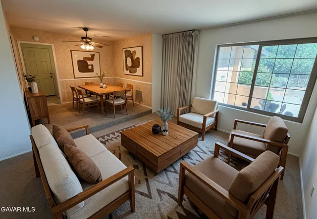 a living room with furniture and a window