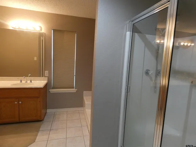 a kitchen with a sink cabinets and window