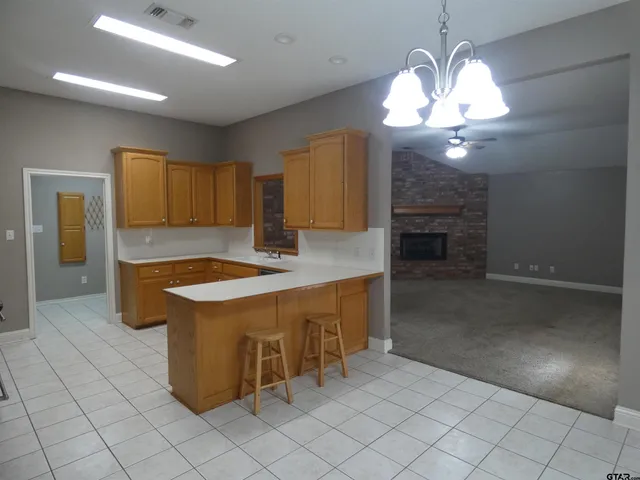 a kitchen with a sink and a stove top oven