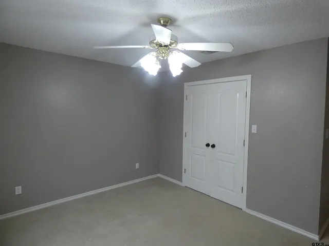 a bathroom with a toilet and bathtub