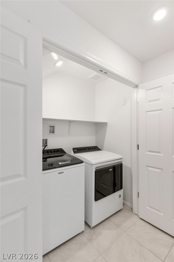 6227 Runestone Street Las Vegas, NV 89113 - Photo 15 of 33 This dedicated laundry area features functional appliances and convenient storage.
