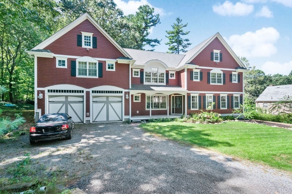 16 Vesta Road Natick, MA 01760 - Photo 1 of 36 a front view of a house with a garden