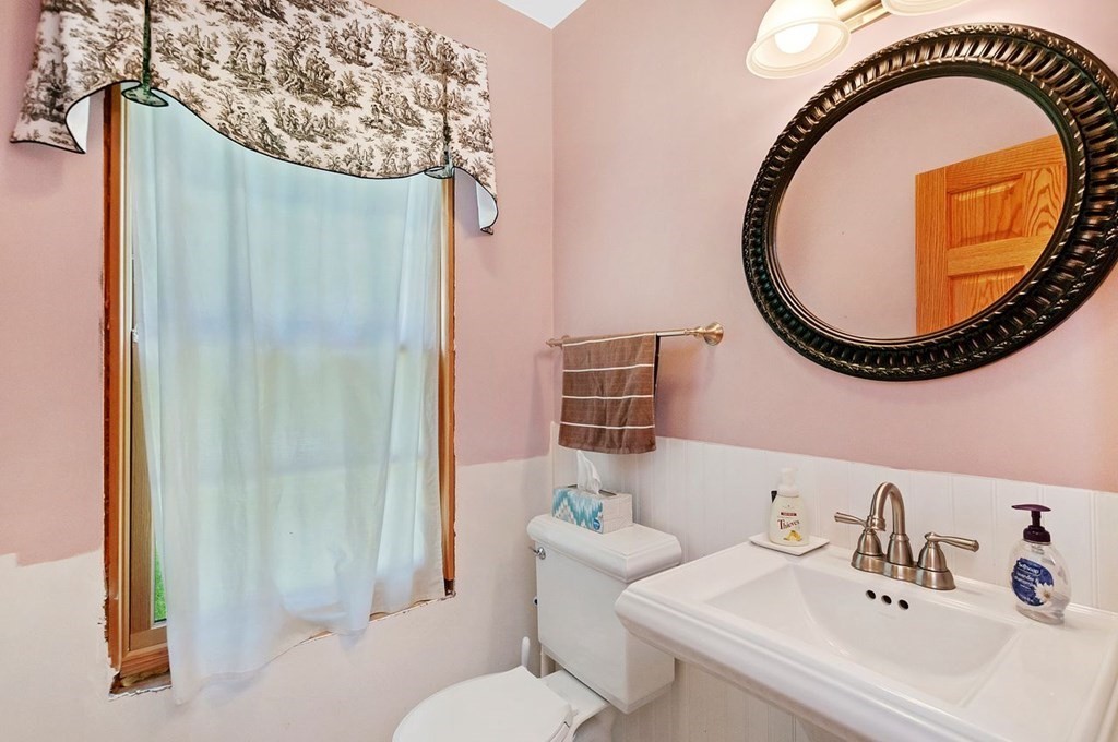 16 Vesta Road Natick, MA 01760 - Photo 13 of 36 a bathroom with a sink and a mirror