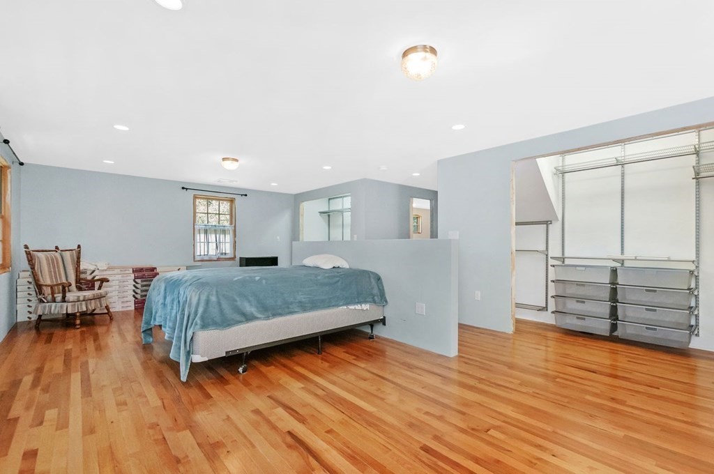 16 Vesta Road Natick, MA 01760 - Photo 14 of 36 a bedroom with a bed and wooden floor