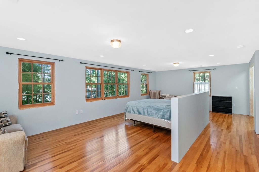 16 Vesta Road Natick, MA 01760 - Photo 16 of 36 a living room with furniture and a wooden floor