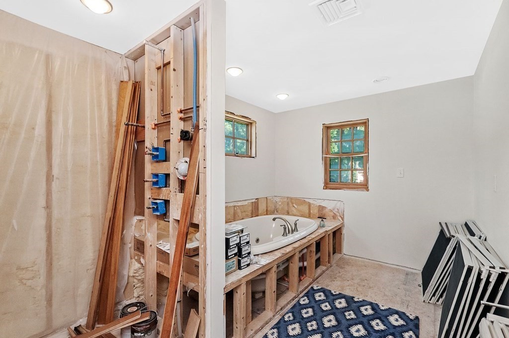 16 Vesta Road Natick, MA 01760 - Photo 17 of 36 a bathroom with a bathtub and a shower