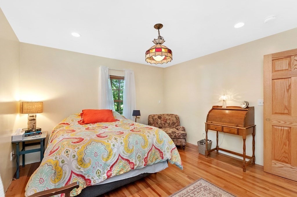 16 Vesta Road Natick, MA 01760 - Photo 18 of 36 a bedroom with two beds and a lamp on table