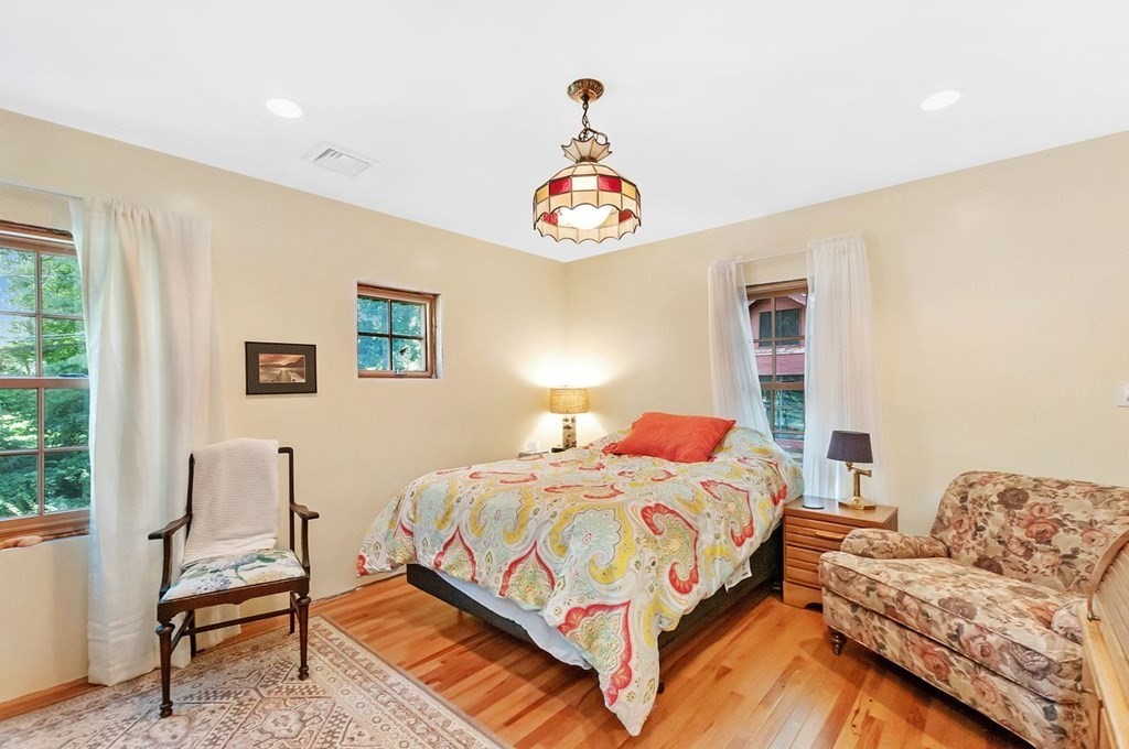 16 Vesta Road Natick, MA 01760 - Photo 19 of 36 a bedroom with a bed and a couch