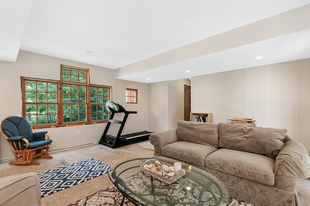 16 Vesta Road Natick, MA 01760 - Photo 25 of 36 a living room with furniture a rug and a window