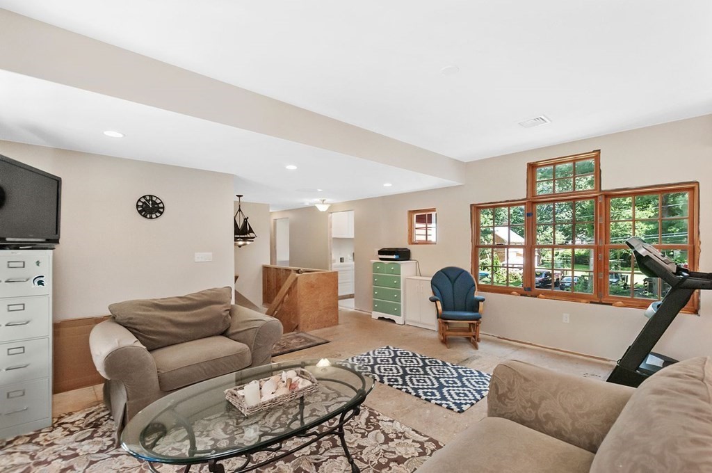 16 Vesta Road Natick, MA 01760 - Photo 27 of 36 a living room with furniture and a flat screen tv