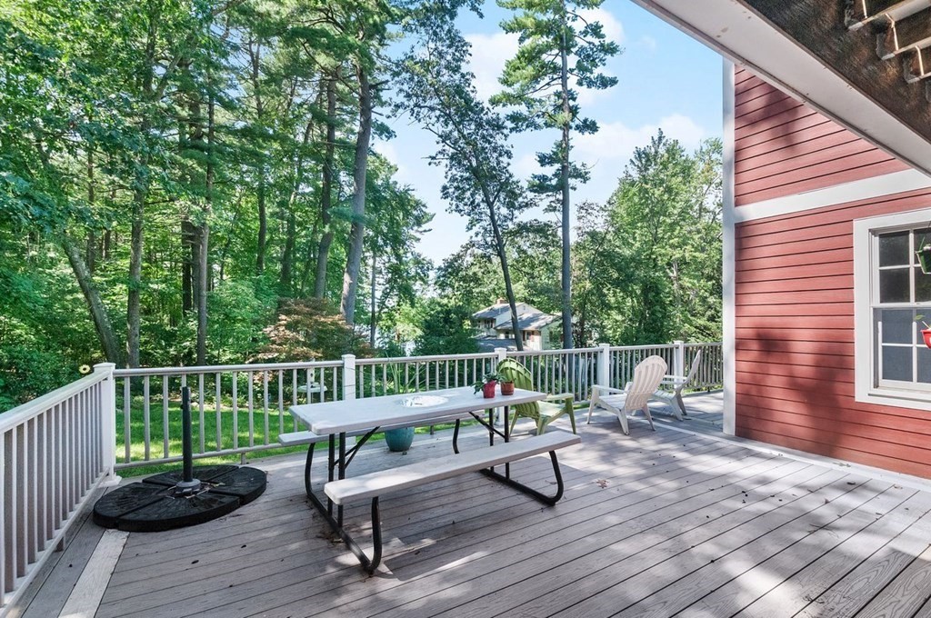 16 Vesta Road Natick, MA 01760 - Photo 31 of 36 a view of a chairs and table on the wooden deck