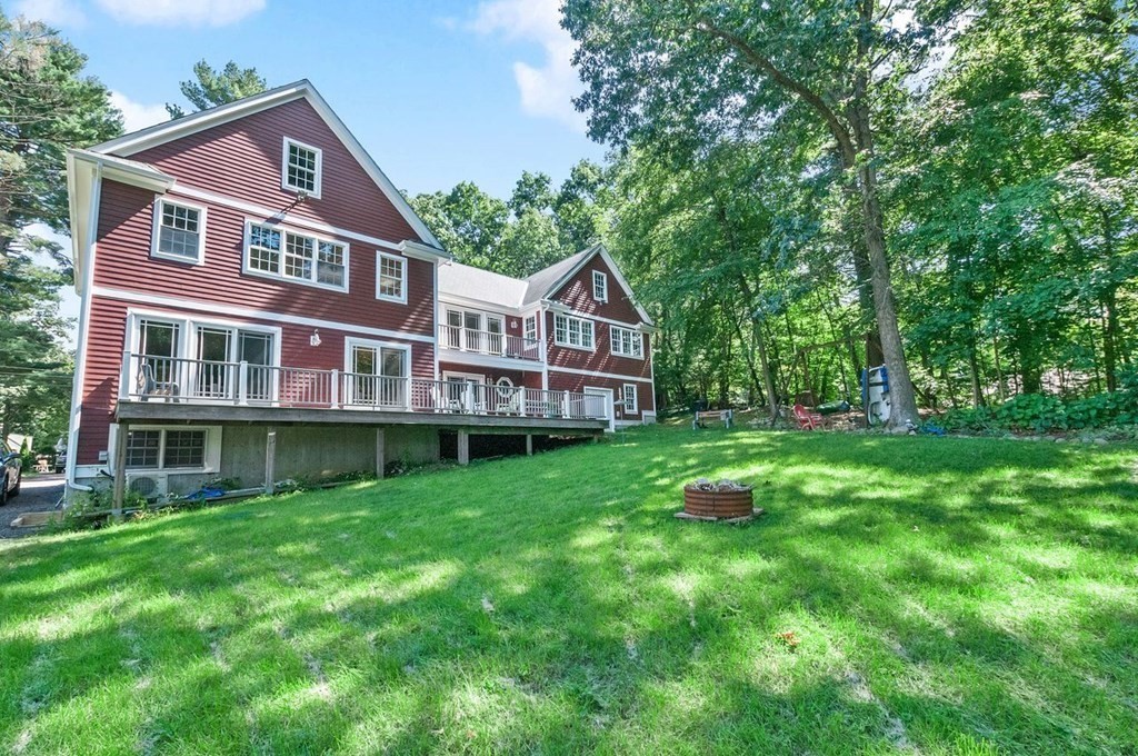 16 Vesta Road Natick, MA 01760 - Photo 34 of 36 a front view of a house with a yard table and chairs