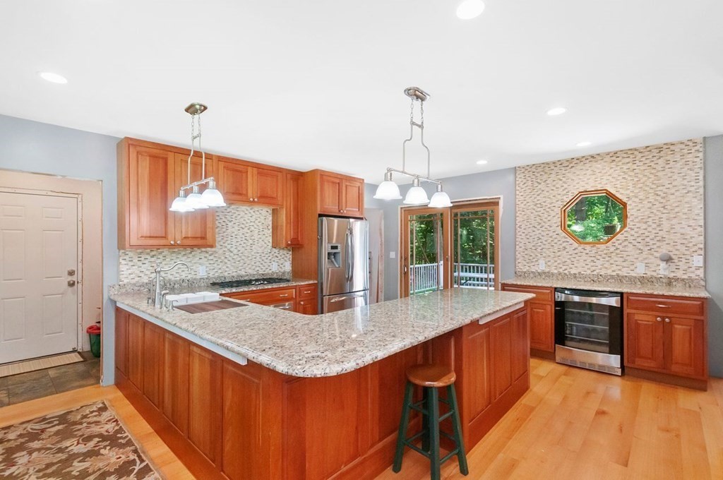 16 Vesta Road Natick, MA 01760 - Photo 5 of 36 a kitchen with stainless steel appliances granite countertop a sink stove and refrigerator