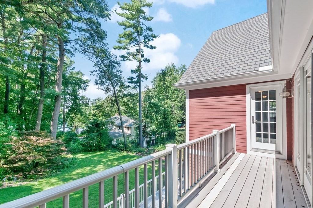16 Vesta Road Natick, MA 01760 - Photo 9 of 36 a view of a balcony with wooden floor and fence