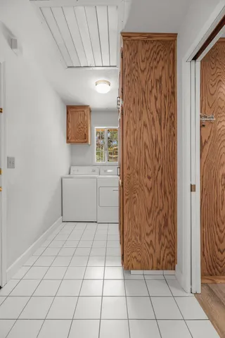 a view of a kitchen with white cabinets and a sink